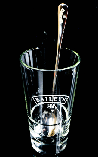 Baileys liqueur, latte macchiato glass liqueur glass in relief with stainless steel spoon